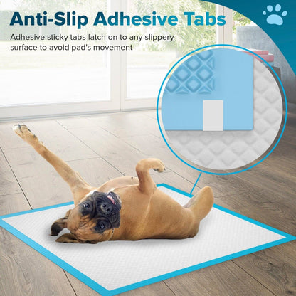 Adhesive corner tabs holding a PetCellence puppy pad flat to the floor